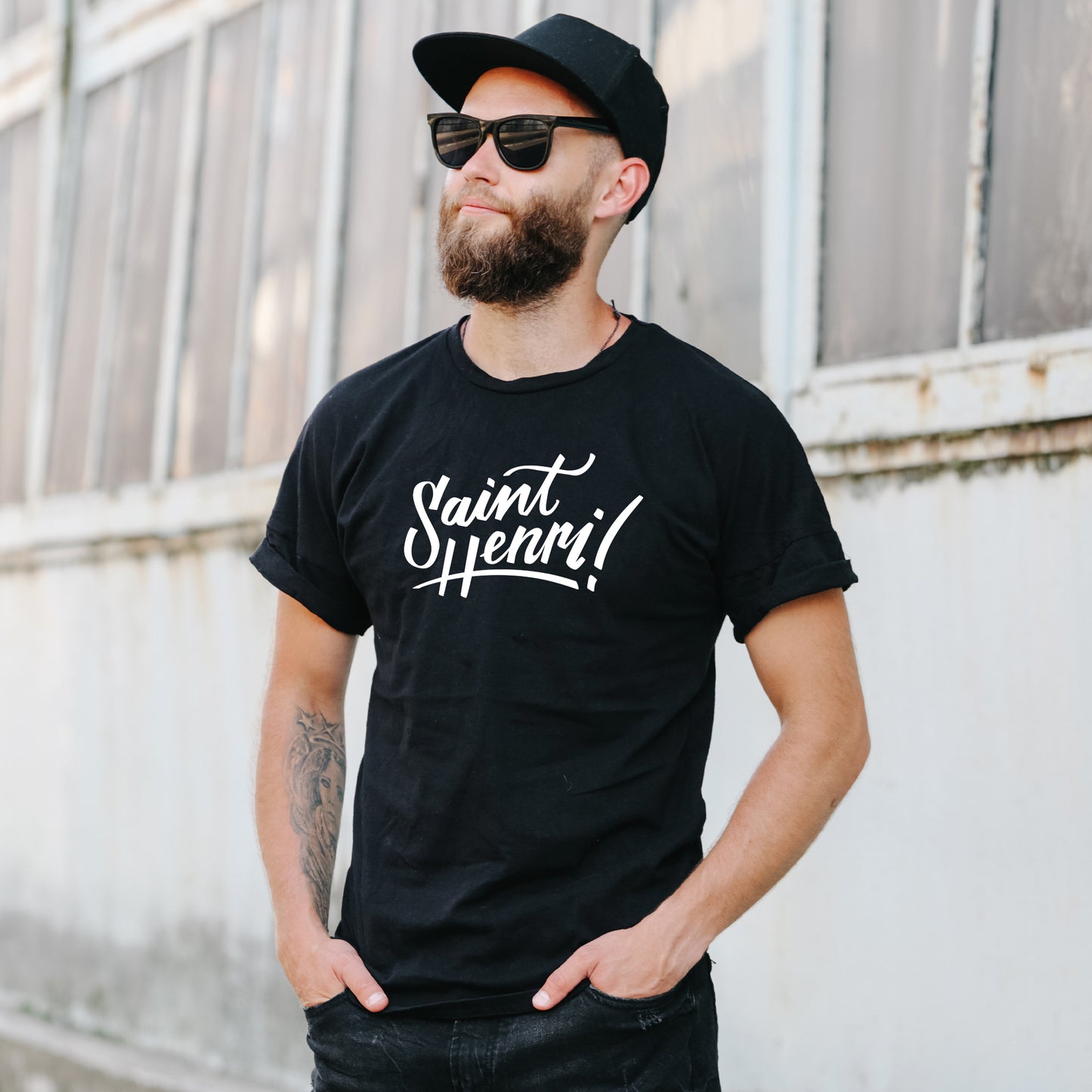 man wearing the saint-henri logo t-shirt, black tee, white print, montreal
