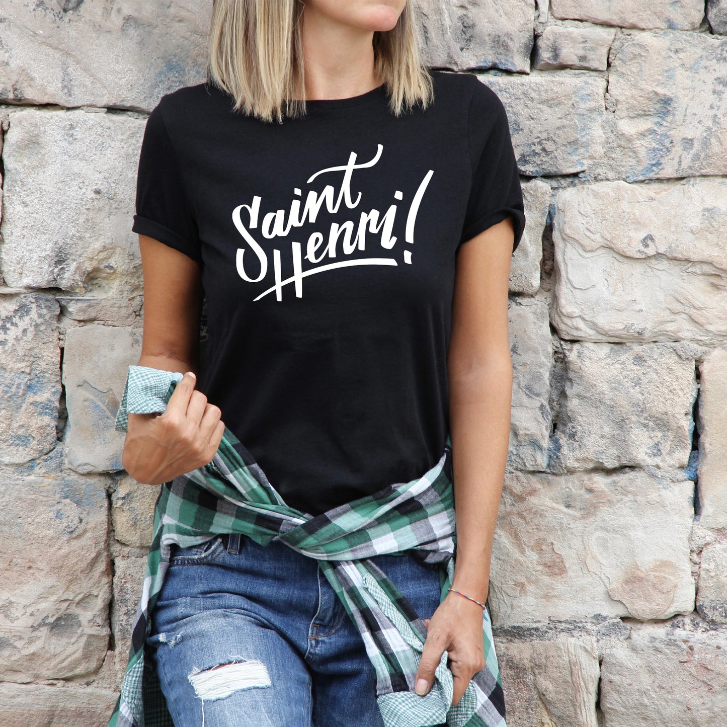 woman wearing saint-henri logo t-shirt, black shirt, white logo imprint, saint-henri, montreal