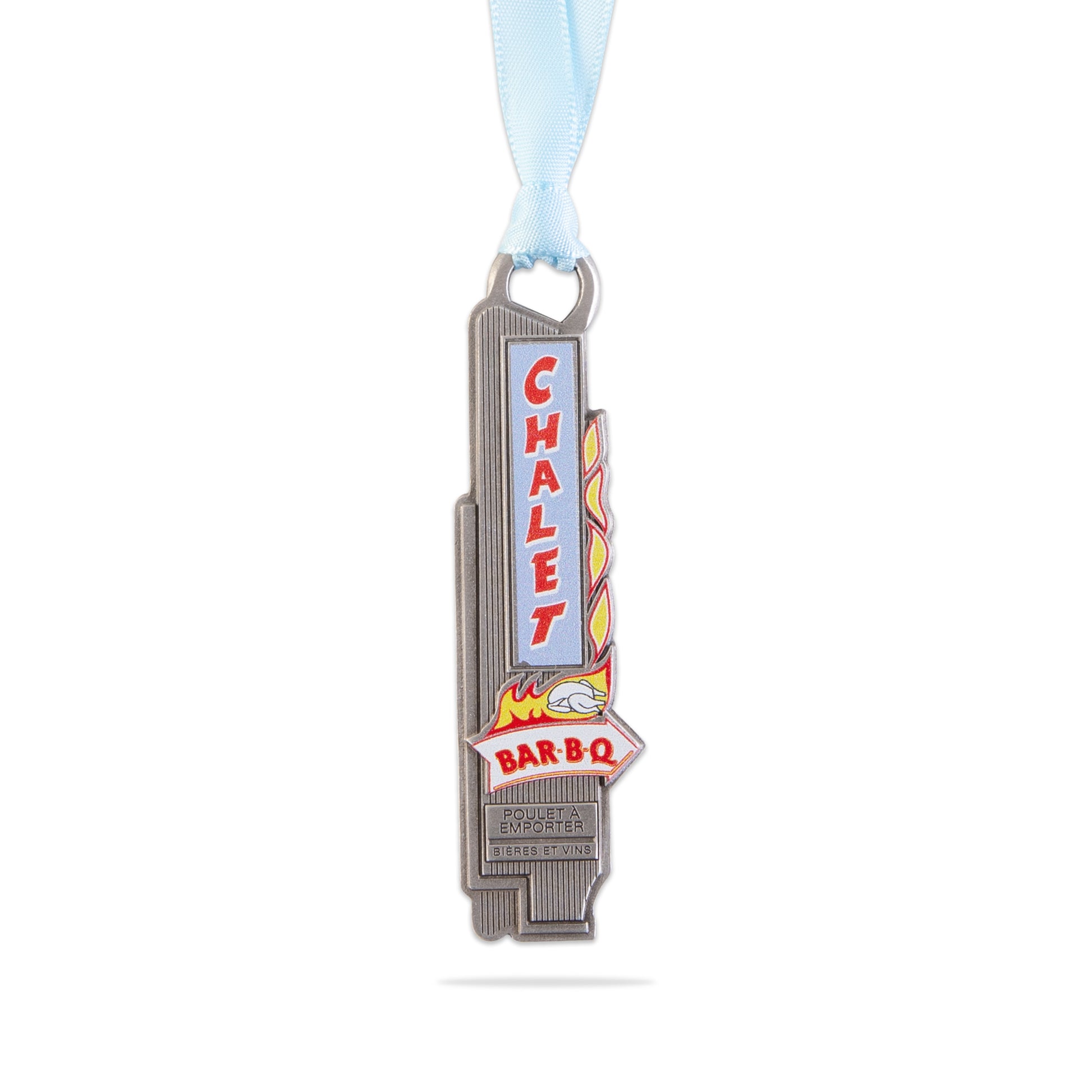 Metallic barbecue-themed medal with 'Chalet Bar B Q' text on a white background