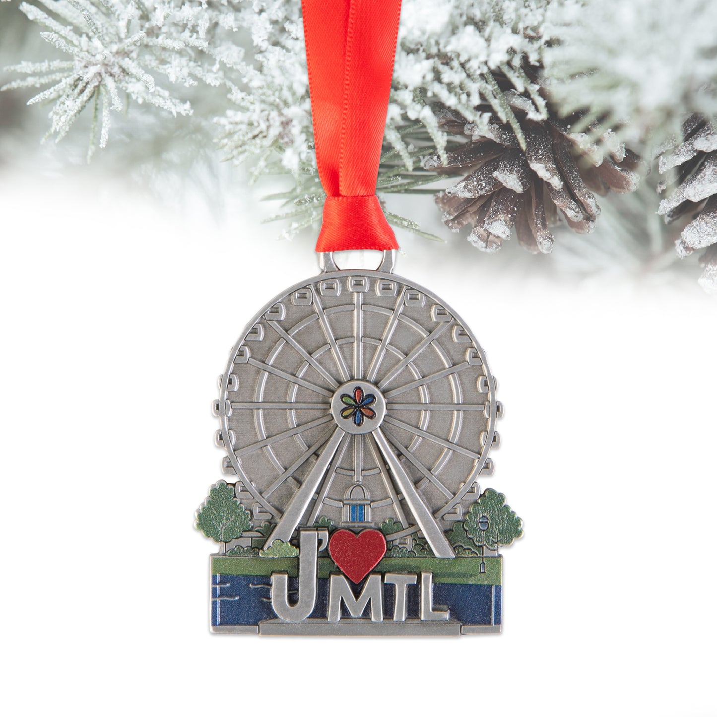 Decorative ornament with ferris wheel design and 'J' ❤️ MTL' text, hanging on a tree.