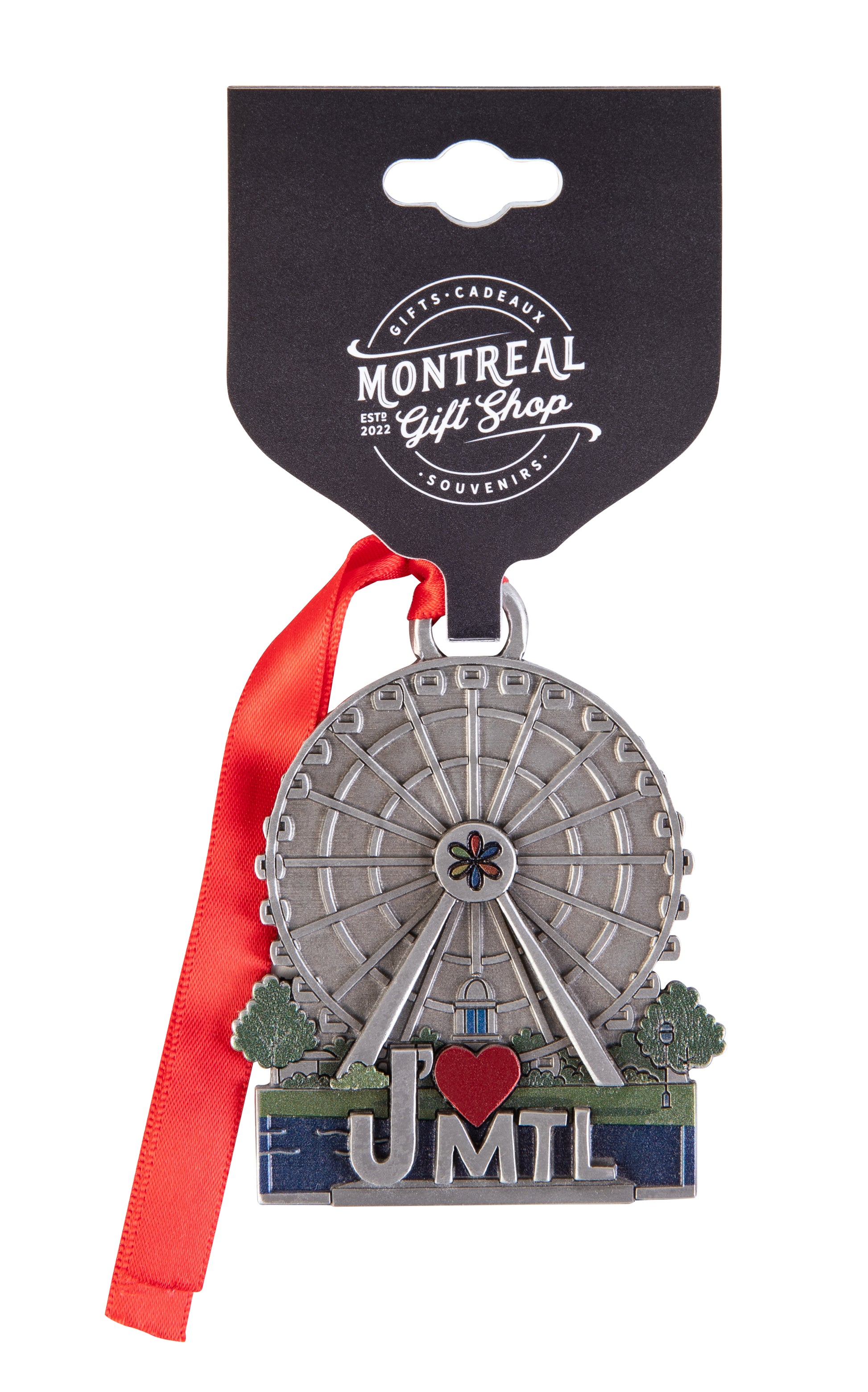 Pewter ornament with ferris wheel design and 'J' ❤️ MTL' text on a black card with 'Montreal Gift Shop' branding.