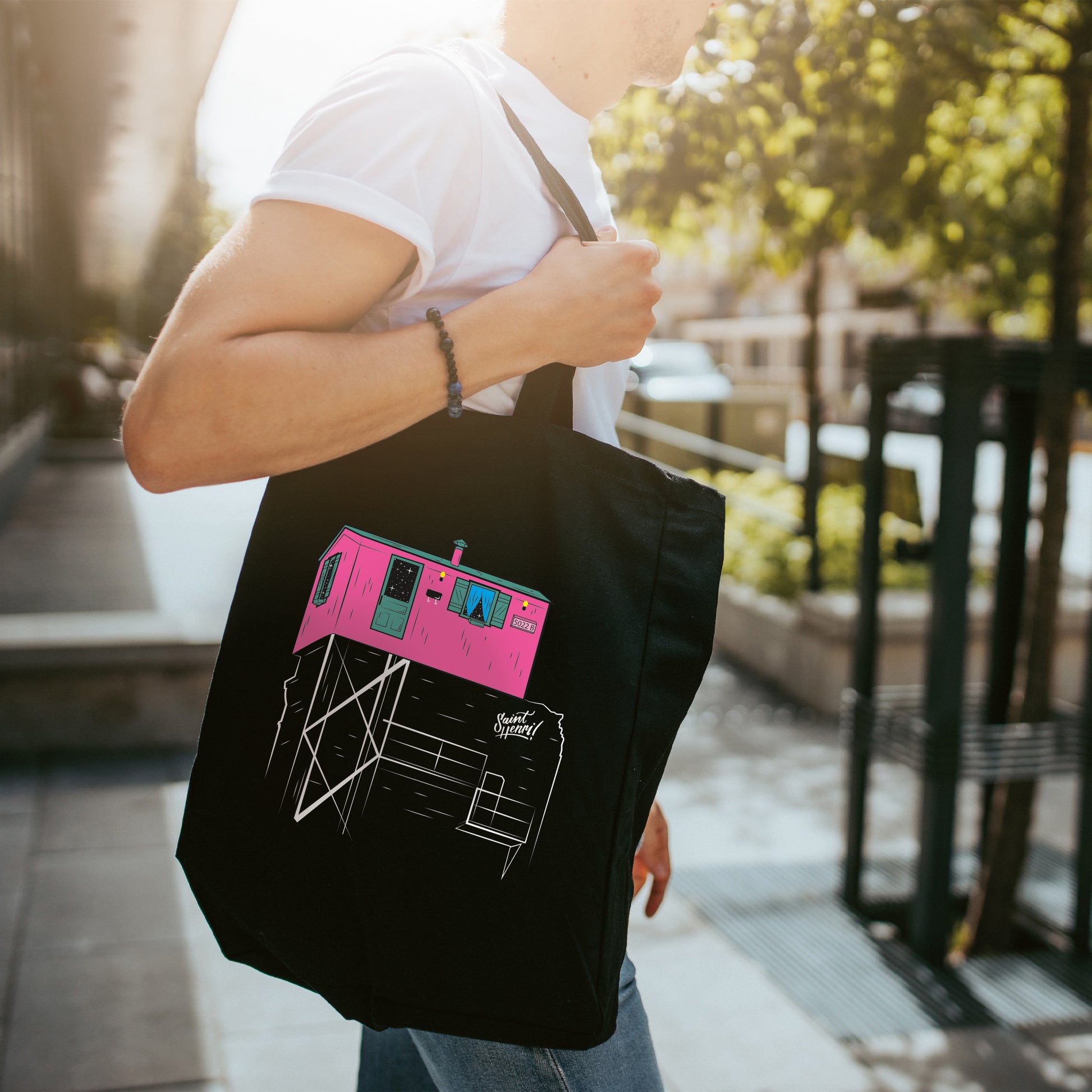 man waliking holding shopping bag, little pink, tote bag, saint-henri, icon, landmark, montreal