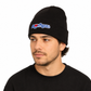A man wearing a black tuque with the Montreal Love design embroidered on the front. 