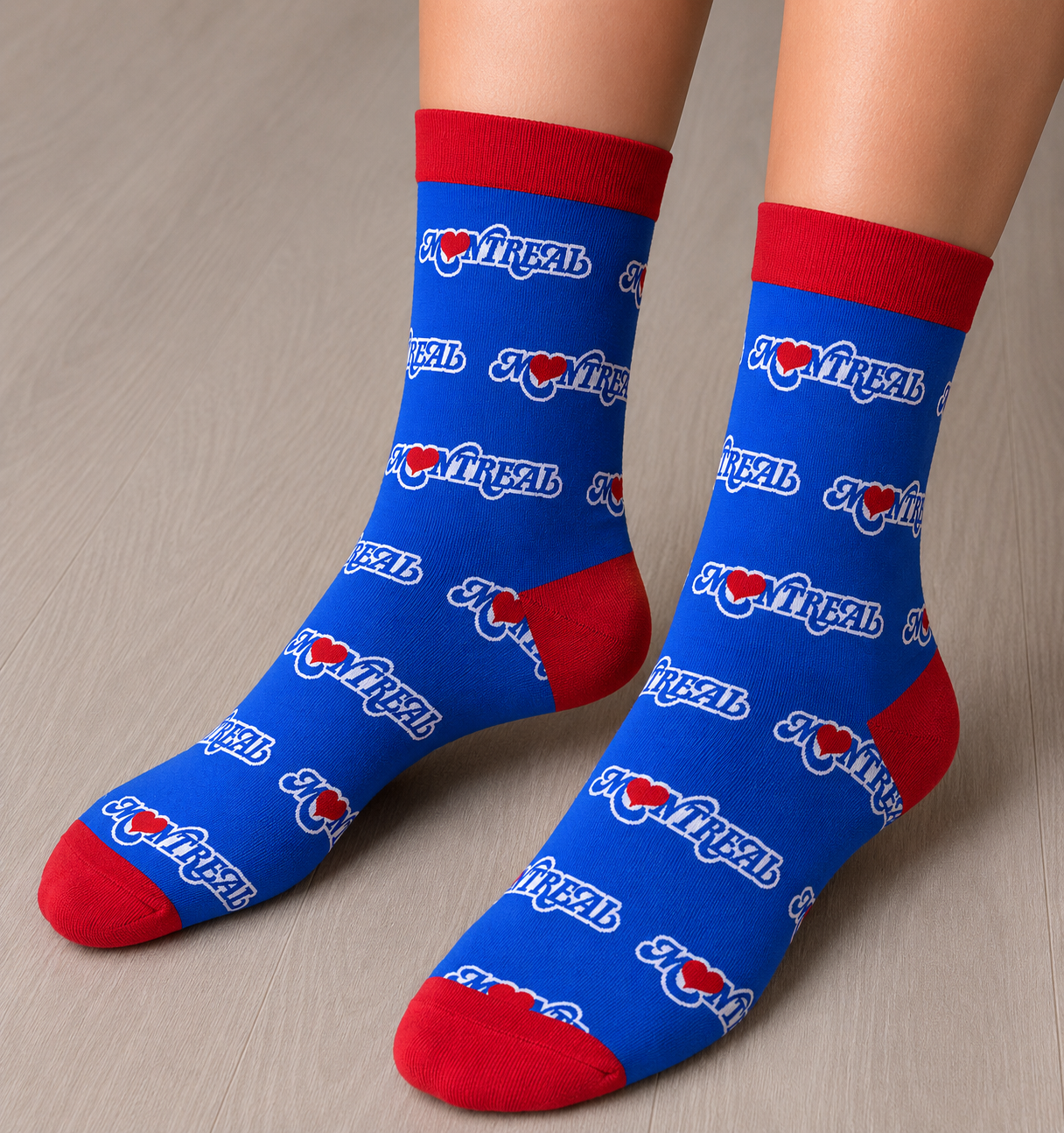 Person wearing two socks, they are blue and red with the Montreal Love design. 