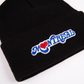 A closeup of a black tuque with the Montreal Love design embroidered on the front. 