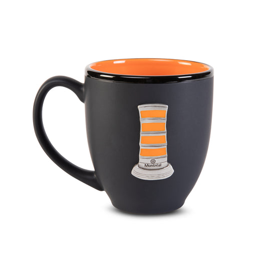 black ceramic mug with orange interior and orange cone pewter crest on front on white background