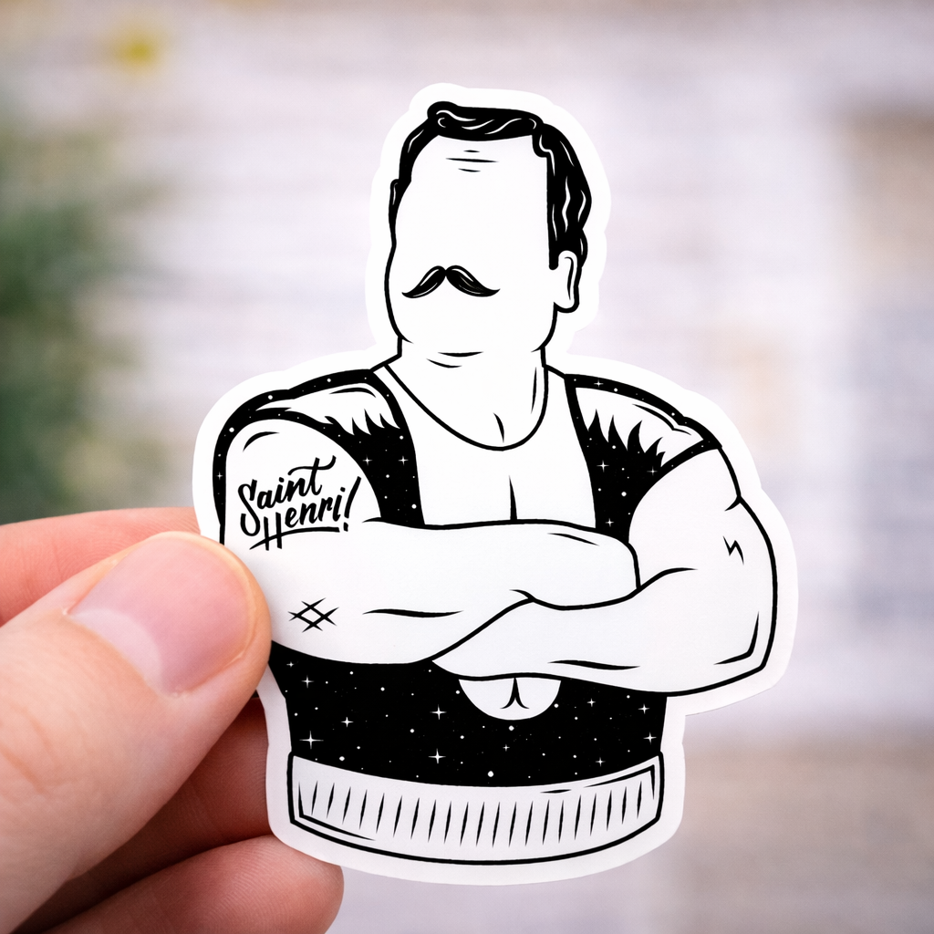 Sticker of louis cyr held by a hand against a blurred background