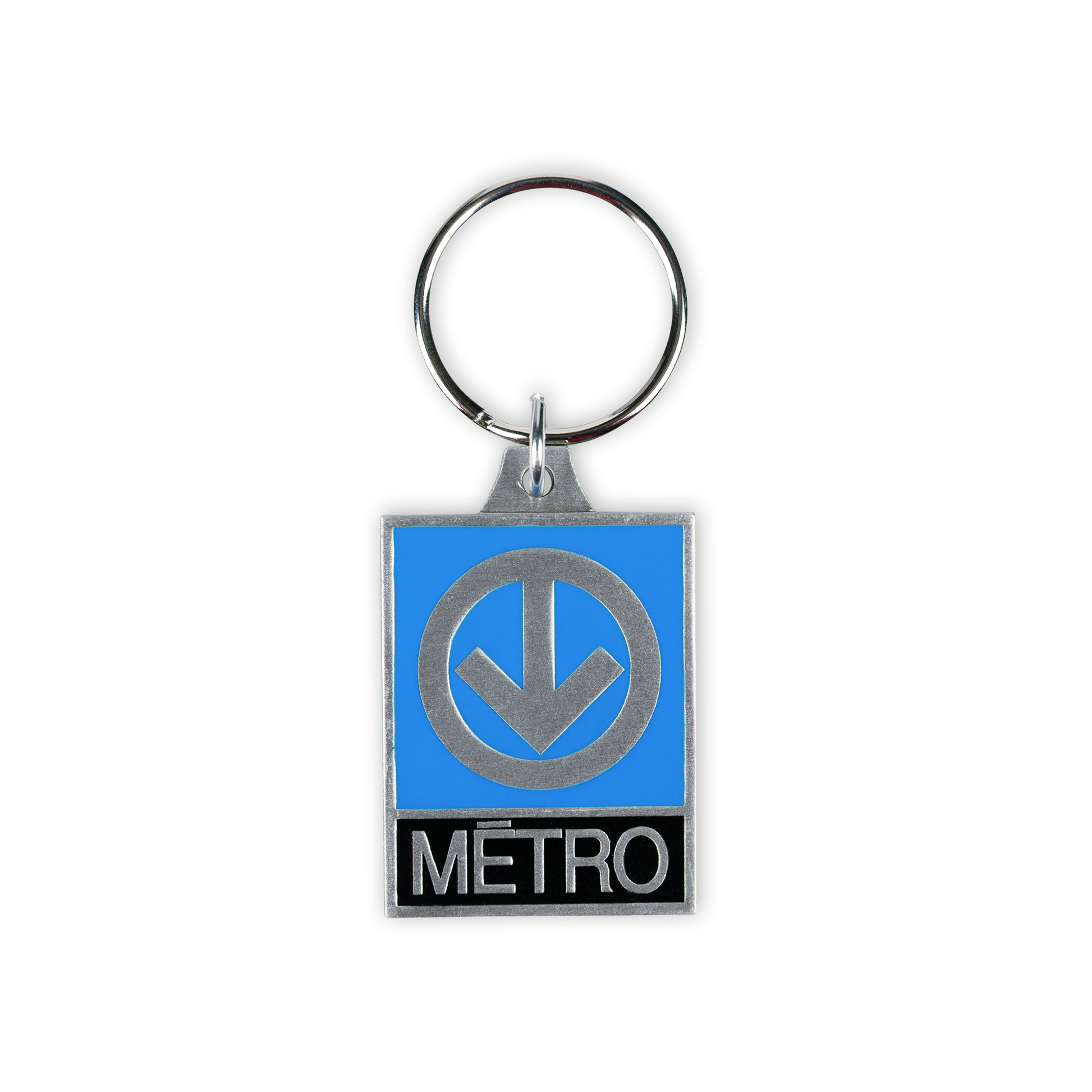 A keychain with the iconic Montreal Metro sign: an arrow pointed down in a circle against a blue background. Below it says "metro"